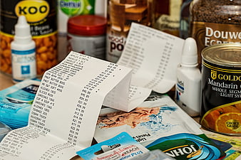 Grocery Receipts and Supermarket Products on a Table