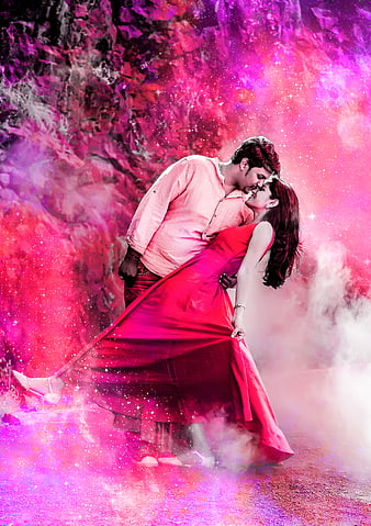 Romantic couple embracing in vibrant pink and purple smoke