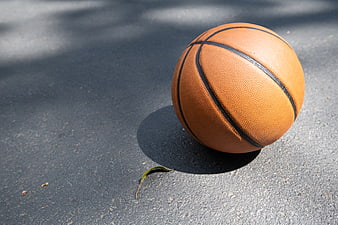 Orange Basketball on Asphalt Court with Copy Space