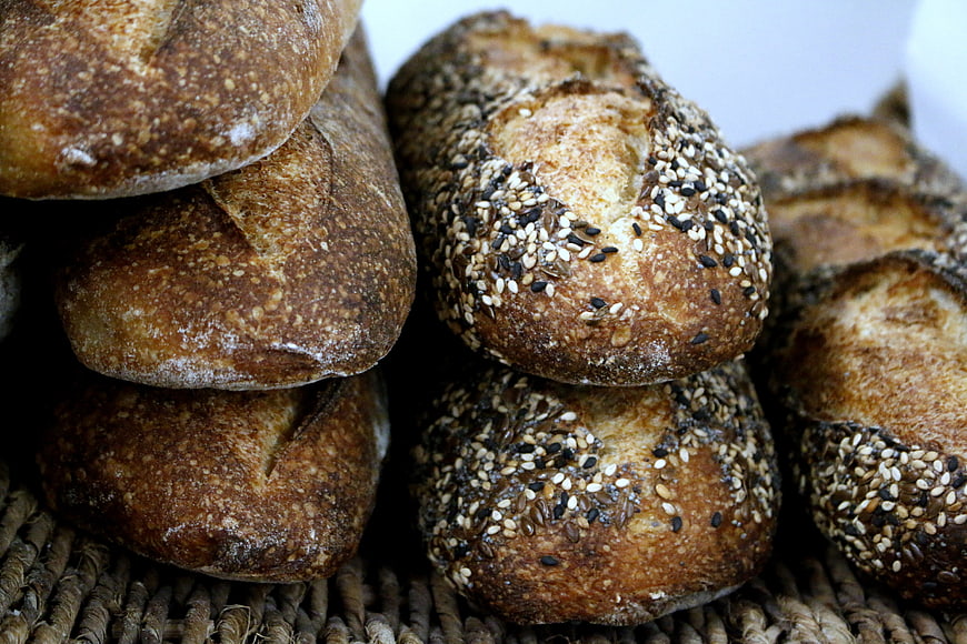 Freshly baked artisan bread loaves with seeds