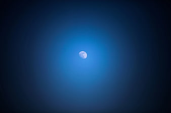 Glowing Moon in Deep Blue Night Sky