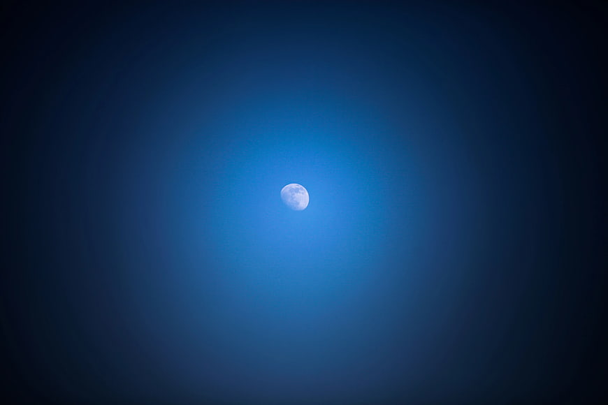 Glowing Moon in Deep Blue Night Sky