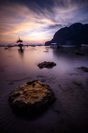 Long Exposure Sunset Seascape with Traditional Fishing Boats