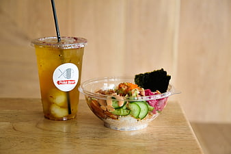 Poke Bowl and Iced Tea on Wooden Table