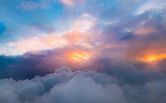Dramatic sunset cloudscape viewed from airplane window