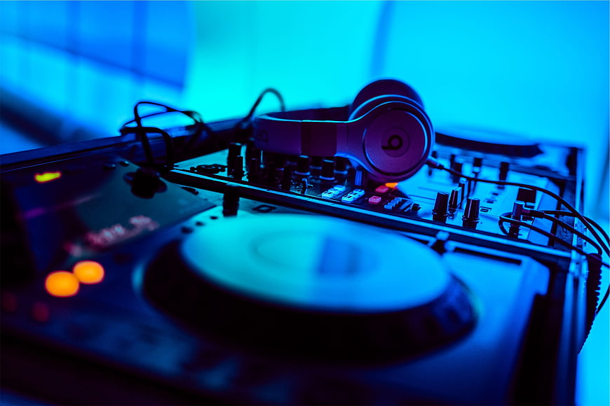 DJ Equipment with Headphones in Blue Neon Light