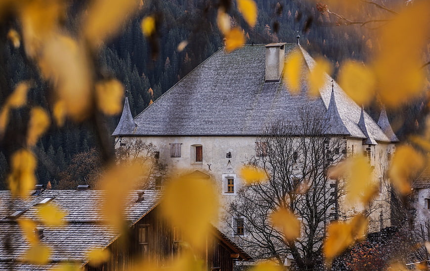 Historic European Castle Framed By Autumn Leaves