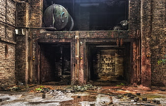 Abandoned Industrial Factory Interior With Rusty Boiler And Brick Ruins
