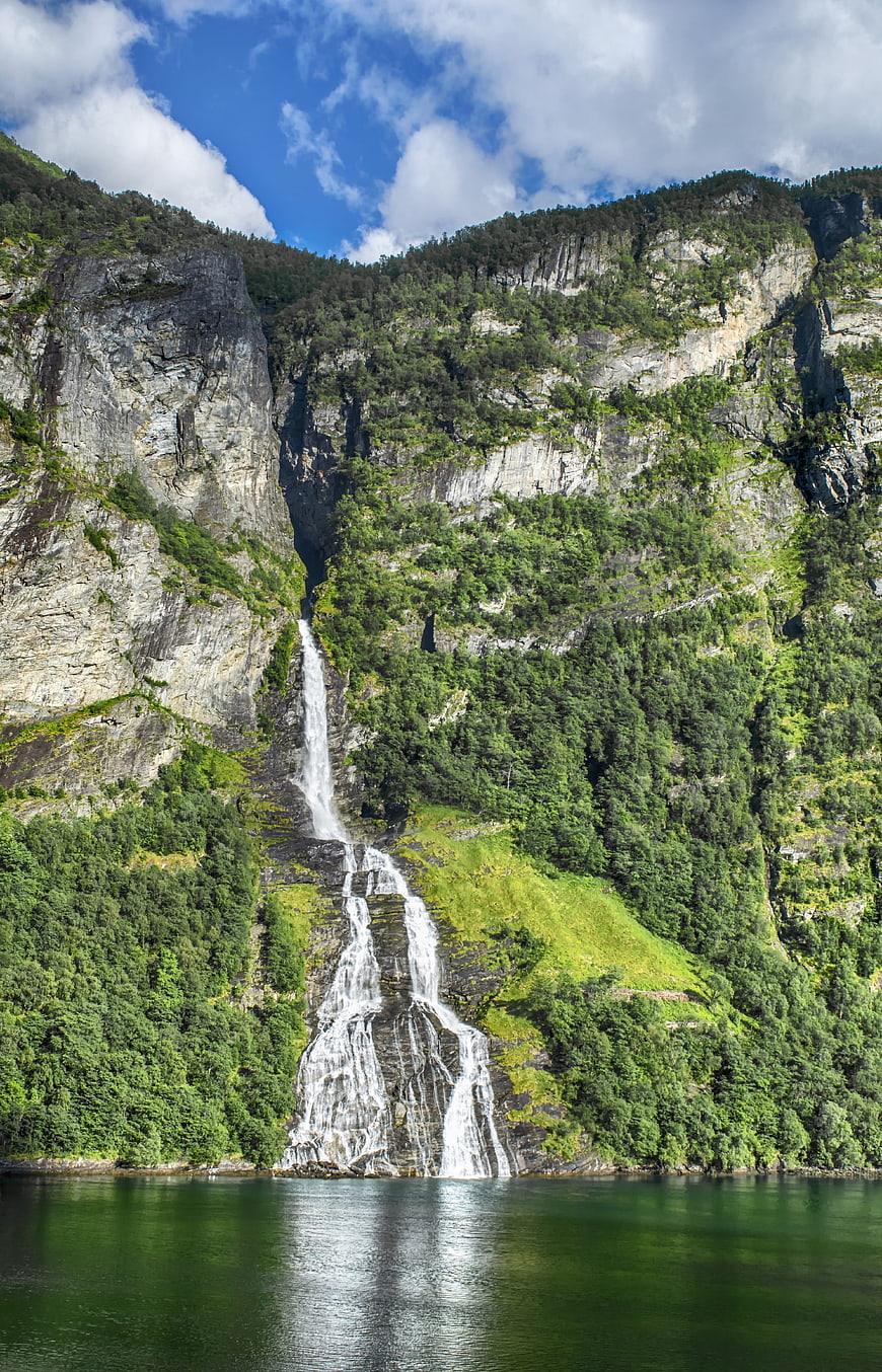 Majestic Waterfall Cascading Into Fjord, Norway