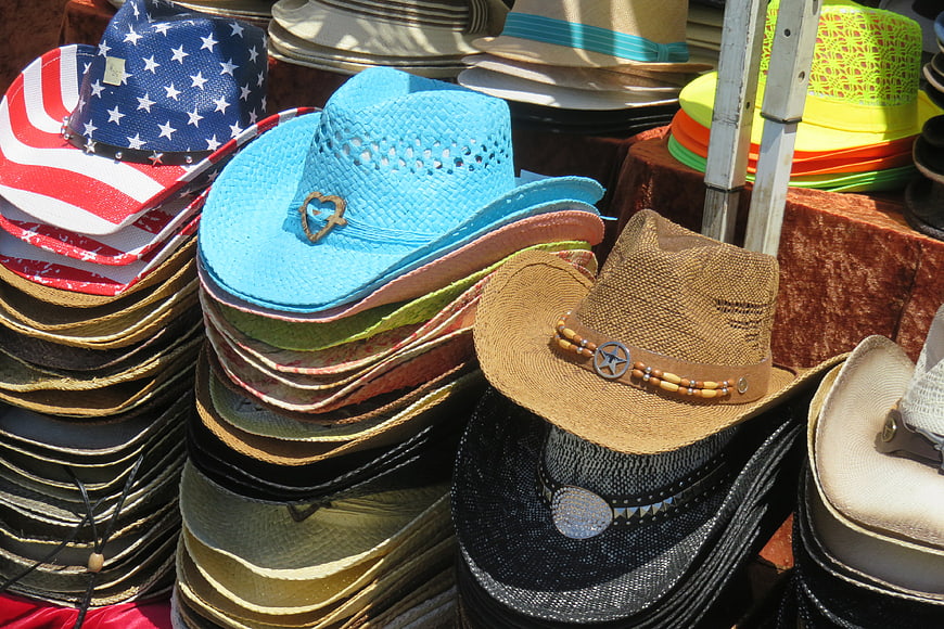 Colorful Stacks of Cowboy Hats at Outdoor Market