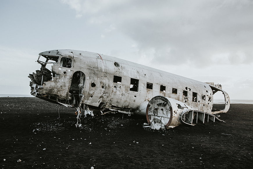 Wrecked DC-3 airplane on black sand beach in Iceland