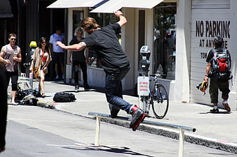 Man Rollerblading on Street Rail in Urban Setting
