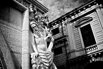 Dramatic Black and White Statue of Man in Venice