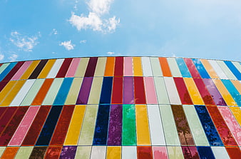 Colorful Curved Architectural Facade Against Blue Sky
