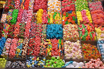Colorful assortment of gummy candies in market bins
