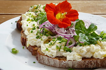 Creamy Potato Salad Toast Topped With Nasturtium Flower And Fresh Herbs