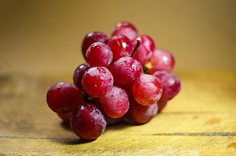 Fresh Red Grapes on Wooden Table