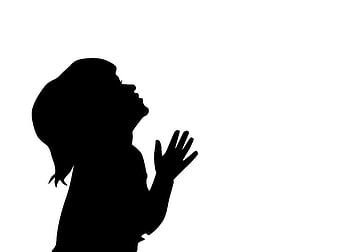 Black silhouette of a child praying with hand raised against white background