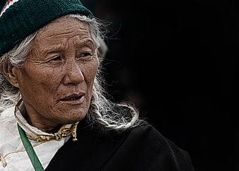 Portrait of elderly Tibetan woman with traditional attire