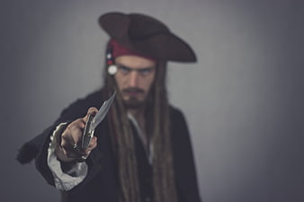 Angry Pirate Man Pointing Knife at Camera