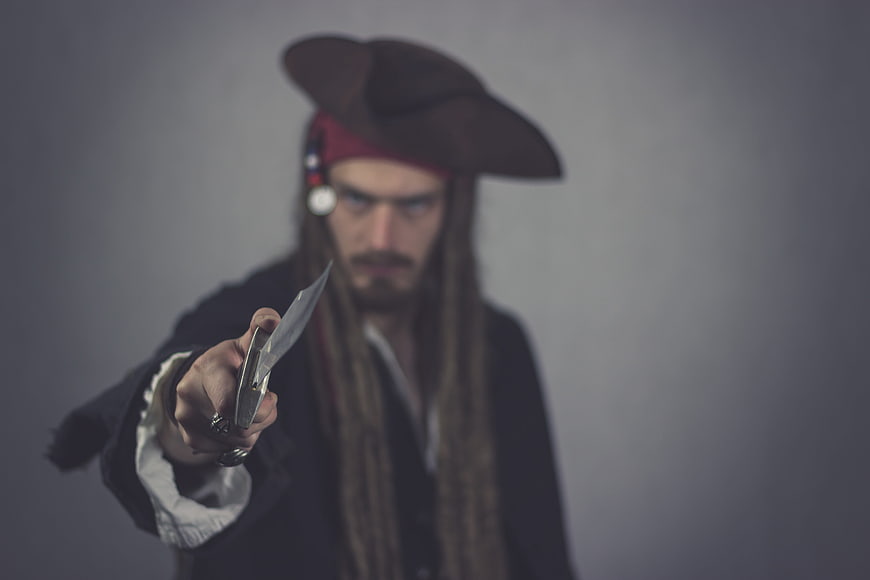 Angry Pirate Man Pointing Knife at Camera