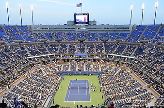 Aerial View of Tennis Stadium with Blue Court and Spectators