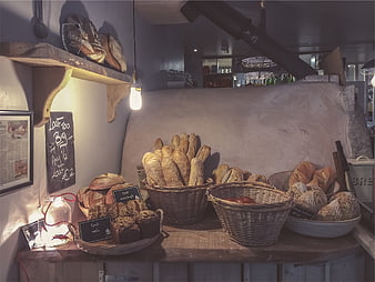 Artisanal bread display in rustic bakery interior
