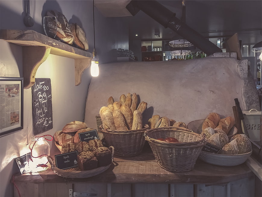 Artisanal bread display in rustic bakery interior