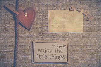 Vintage rustic flat lay with heart, rope, and inspirational quote