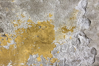 Textured Concrete Wall with Peeling Yellow Paint