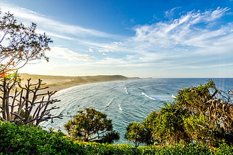 Scenic coastal landscape with ocean waves and blue sky