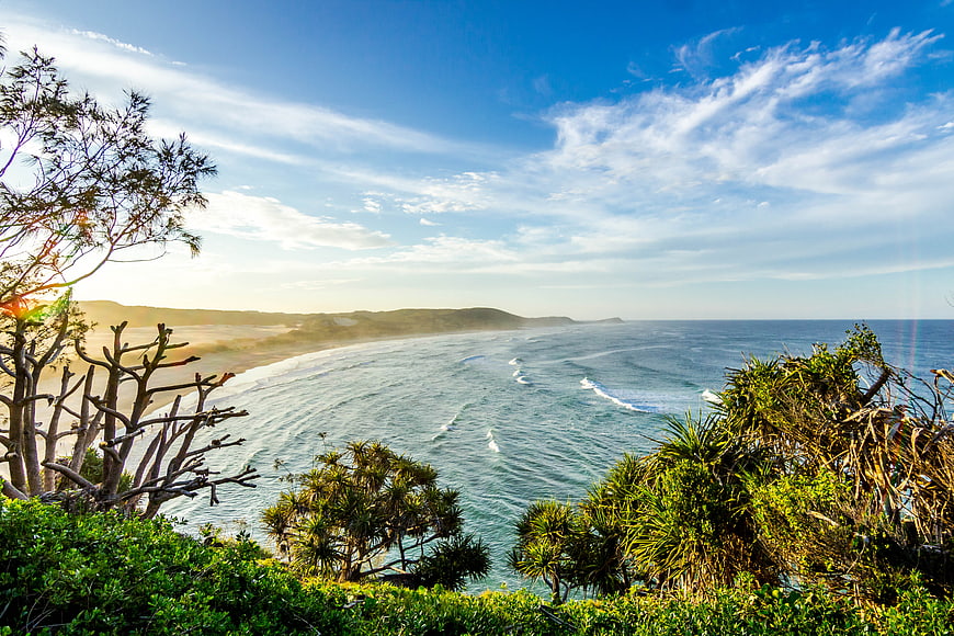 Scenic coastal landscape with ocean waves and blue sky