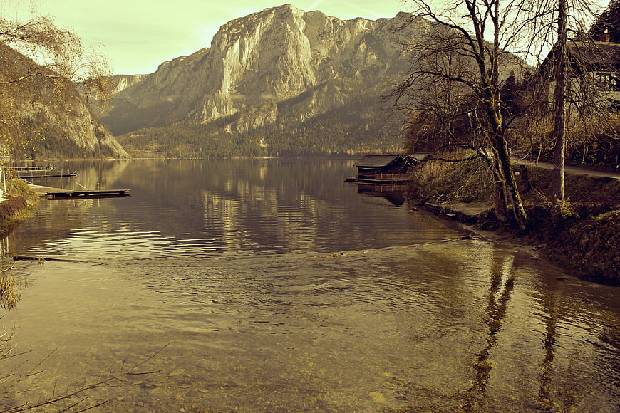 Serene Alpine Lake with Mountain Reflections and Vintage Filter