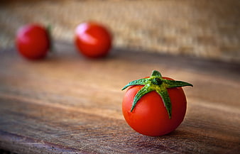 Fresh Red Tomato on Wooden Cutting Board