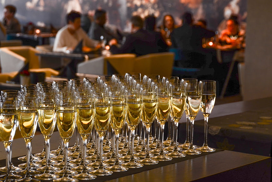 Rows of champagne flutes at a luxury event reception