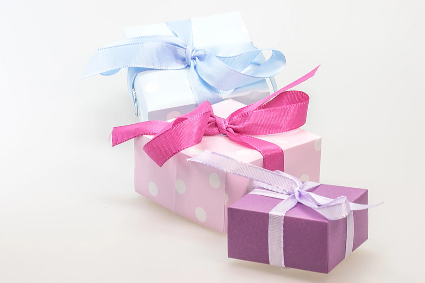 Pastel Gift Boxes with Ribbons on White Background
