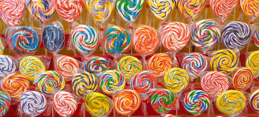 Colorful Swirl Lollipops Displayed in Rows