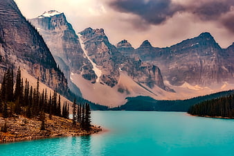 Moraine Lake turquoise water with mountains and pine trees