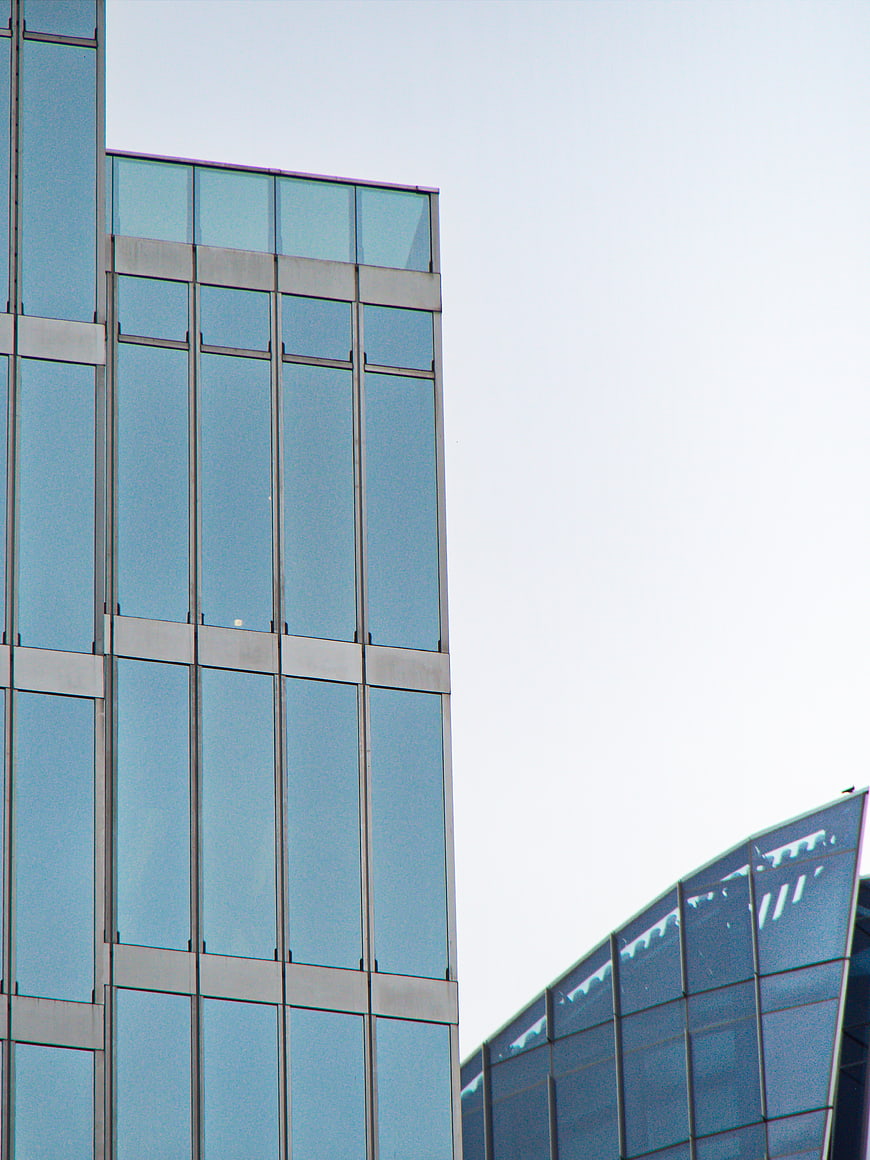 Modern Glass Office Building Facade with Blue Windows