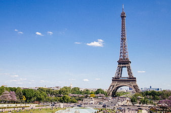 Eiffel Tower Paris Skyline with Park and Blue Sky