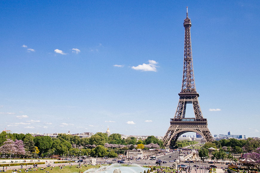 Eiffel Tower Paris Skyline with Park and Blue Sky