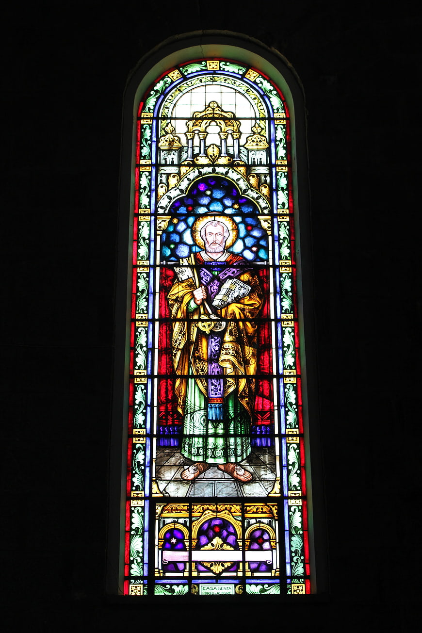 Vibrant Stained Glass Window of Saint in Church