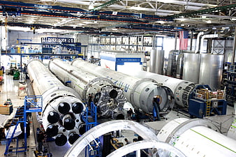 SpaceX Falcon 9 rocket assembly in manufacturing facility