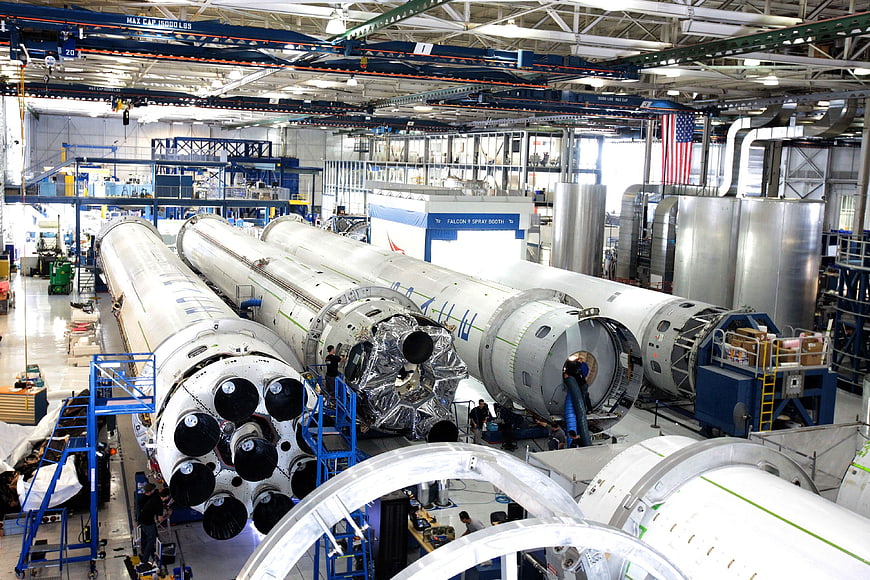 SpaceX Falcon 9 rocket assembly in manufacturing facility