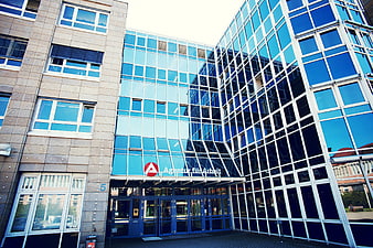Modern Glass Office Building with Employment Agency Signage