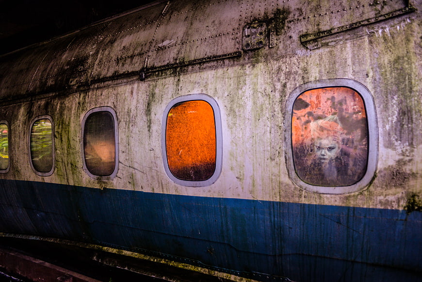 Creepy abandoned airplane wreckage with ghostly reflection