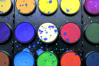 Colorful watercolor paint palette with splatters