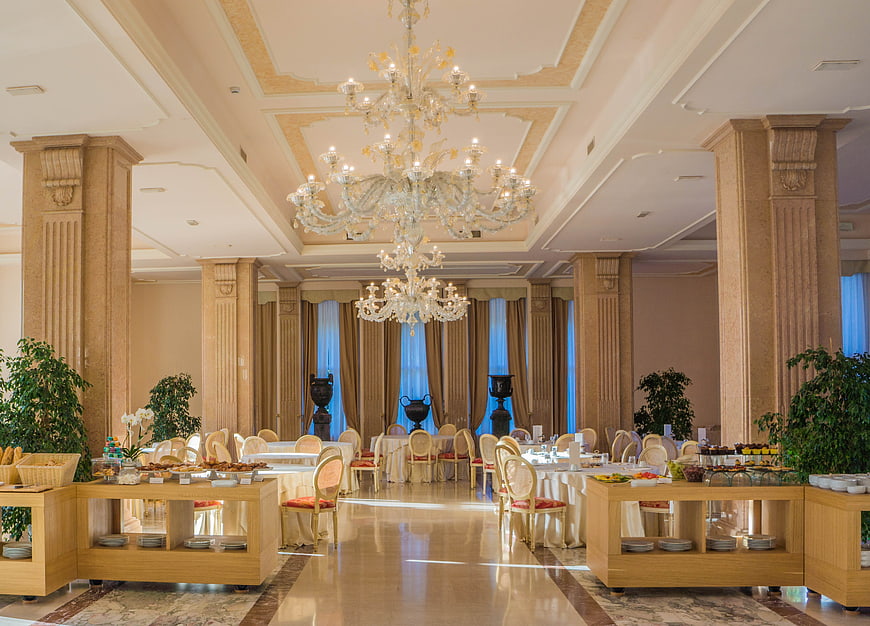 Luxury hotel breakfast buffet dining room with chandelier