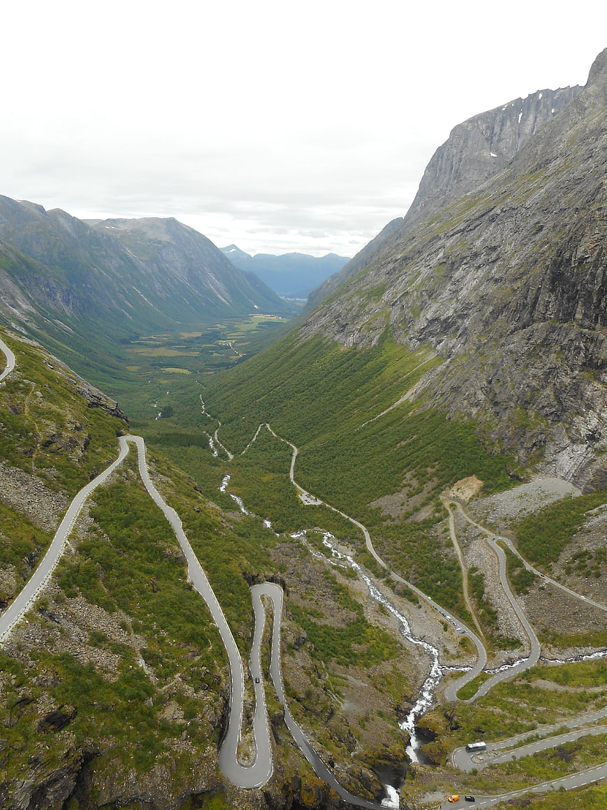 Winding Mountain Road Through Green Valley in Norway