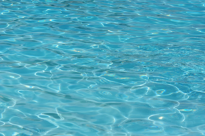Close-up of rippling blue swimming pool water surface